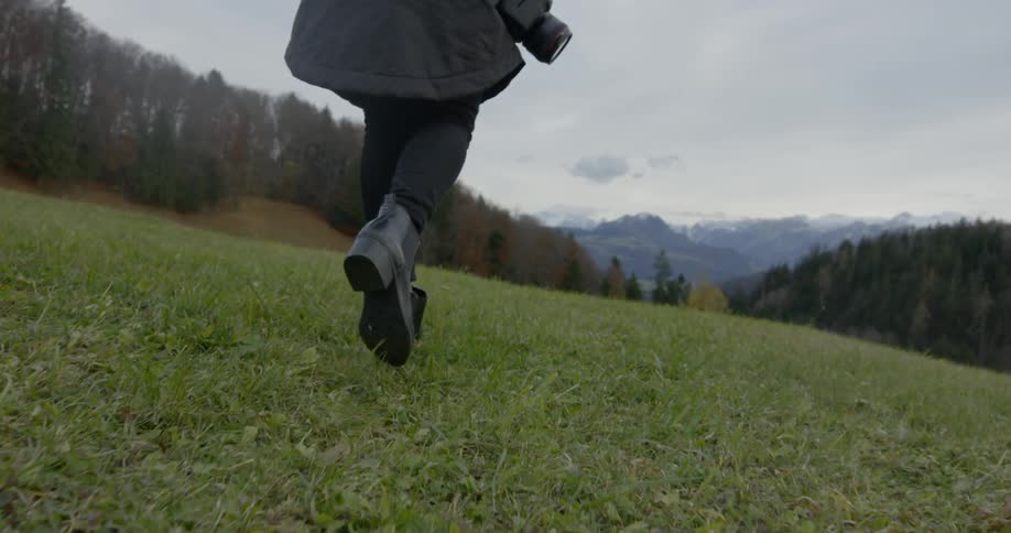 A person walks on the grass