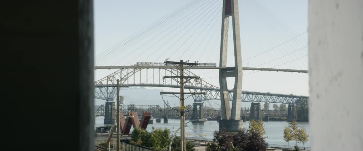 A train moves across a suspension bridge