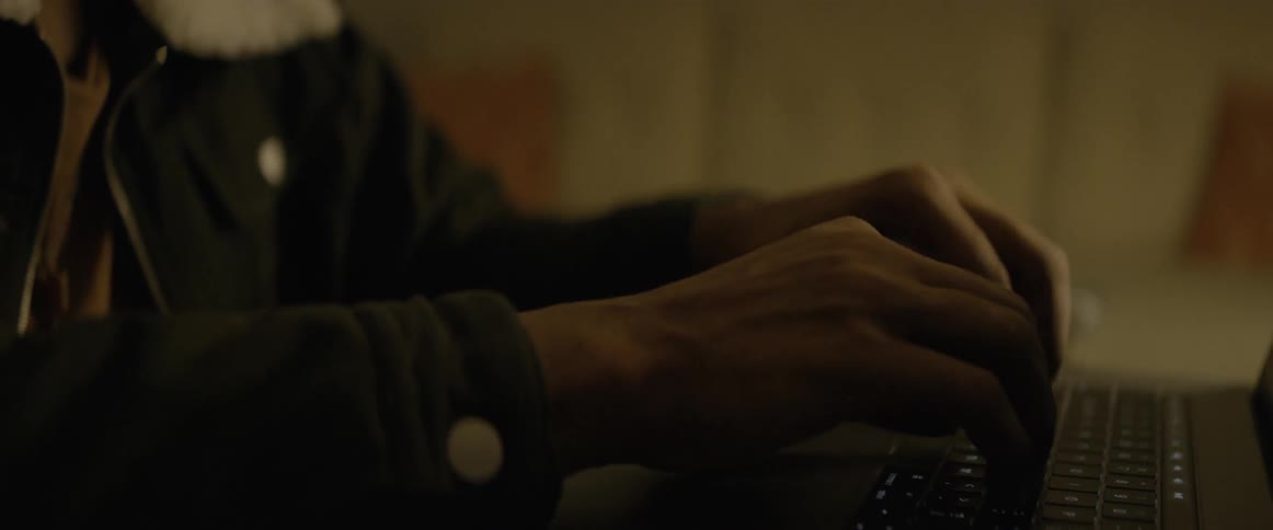 Male typing on a computer