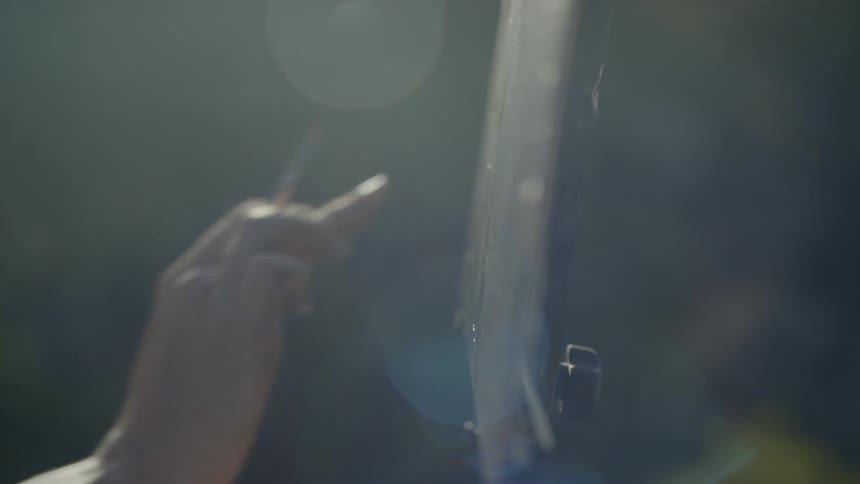 A person painting outside