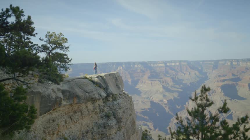 Female standing on a plateau in the grand canyon