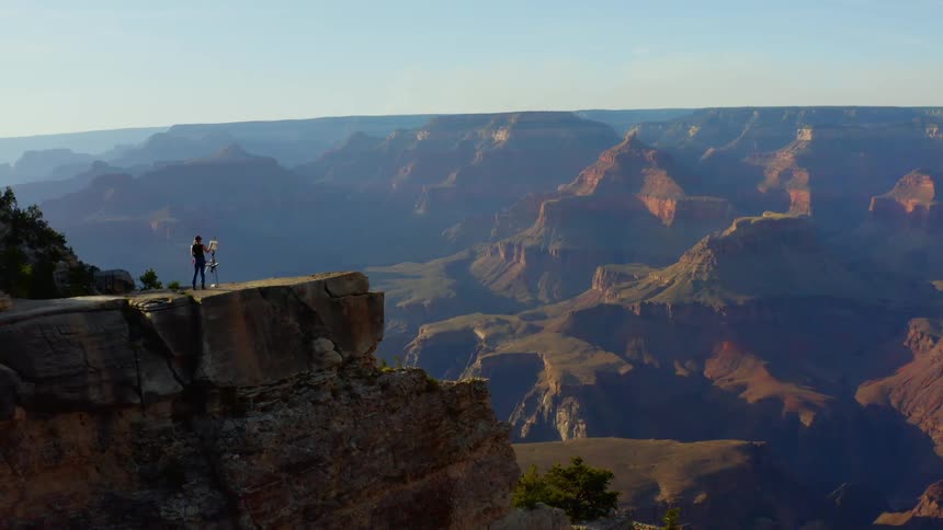 Someone paints on the cliff