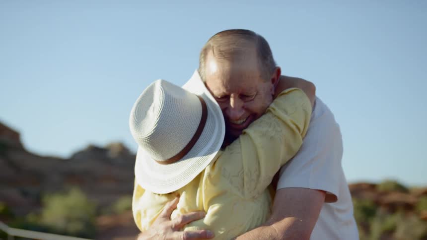 An old couple hugging