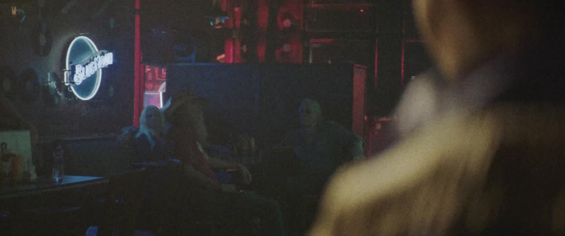 A person looks across a bar