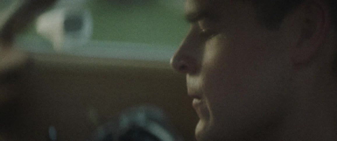 A man sitting in a car thinking