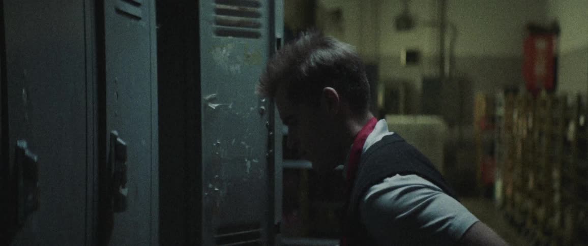 A man is looking inside a locker