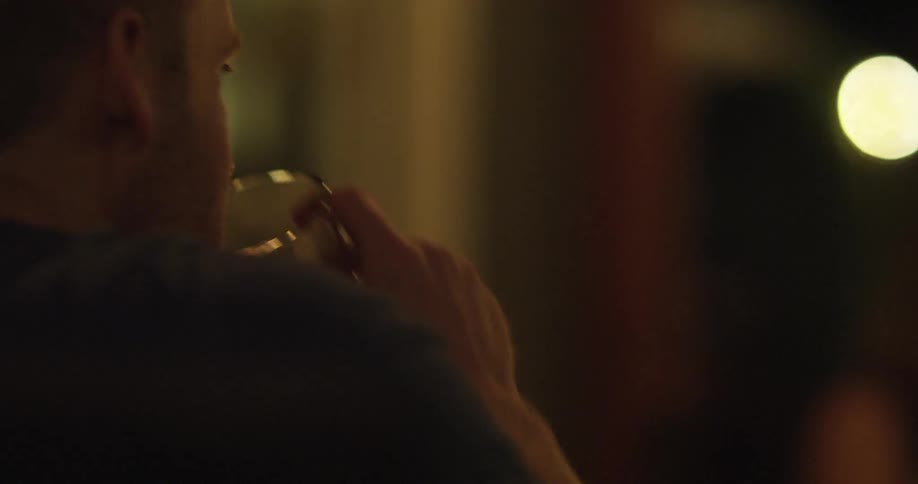 A person drinking out of a glass