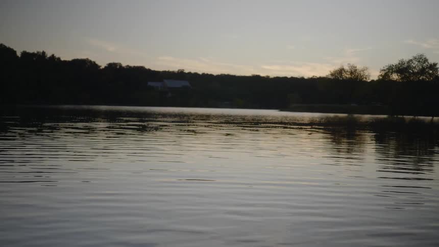 Lake calm waters at sunset