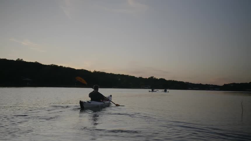 Man kayaking on a lake
