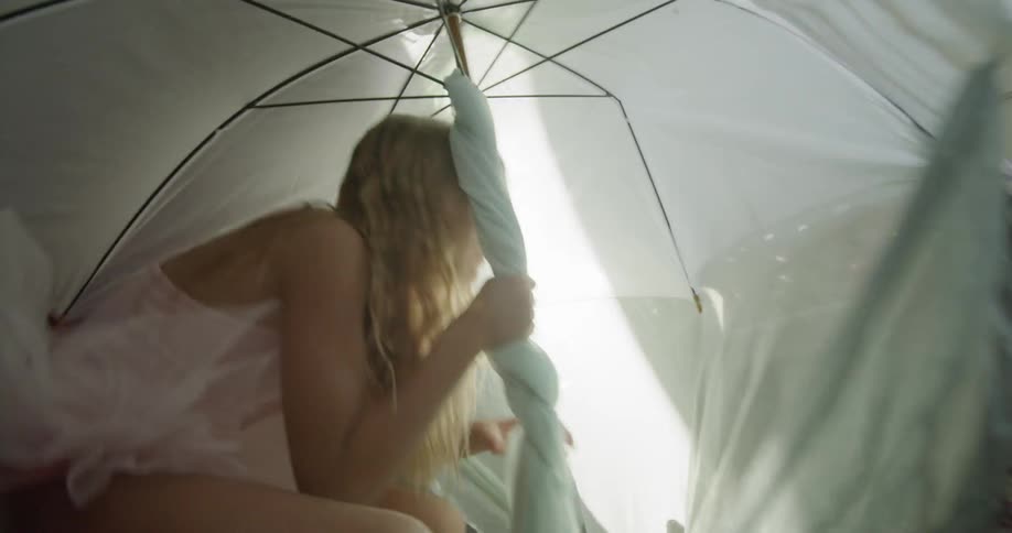 A woman with dress under white umbrella