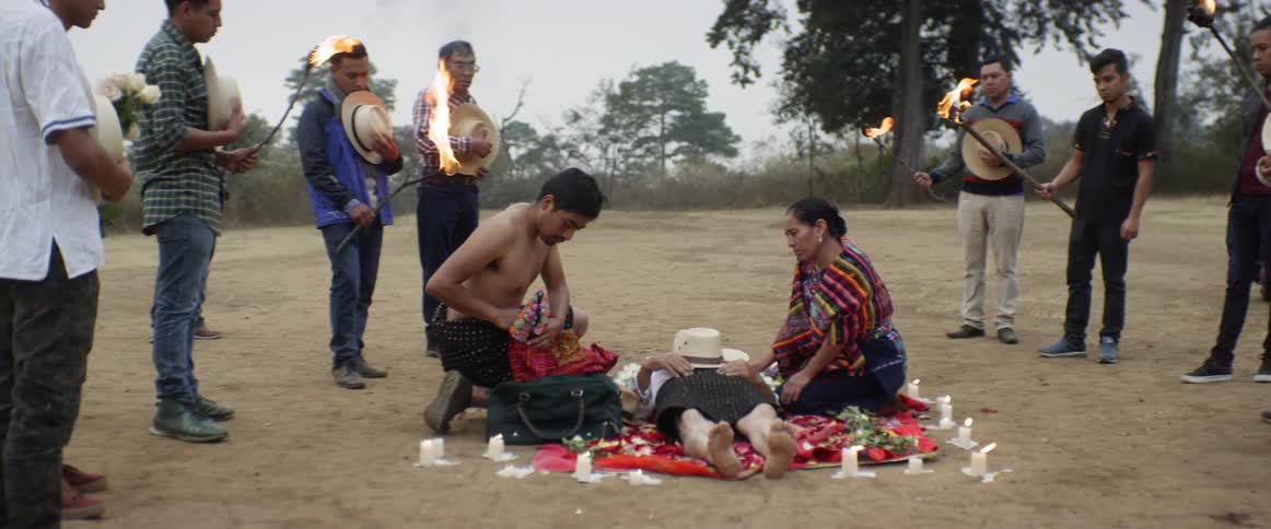 A group of people preparing something for someone dying