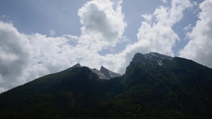 A time lapse scenery of a mountain peak