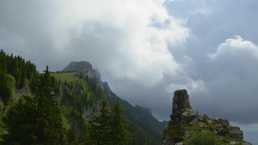 Time lapse of clouds moving over the mountain top