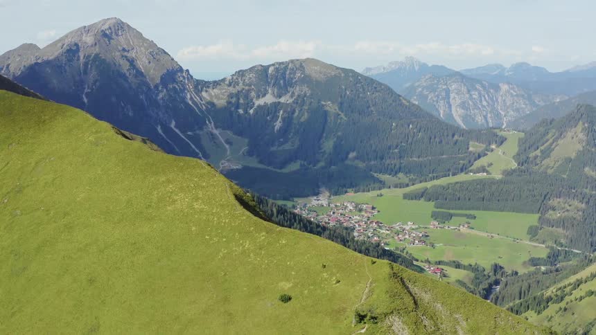 In the midst of a mountain range is a valley with a small community situated in it
