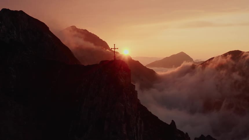 An aerial view of a mountain at dawn