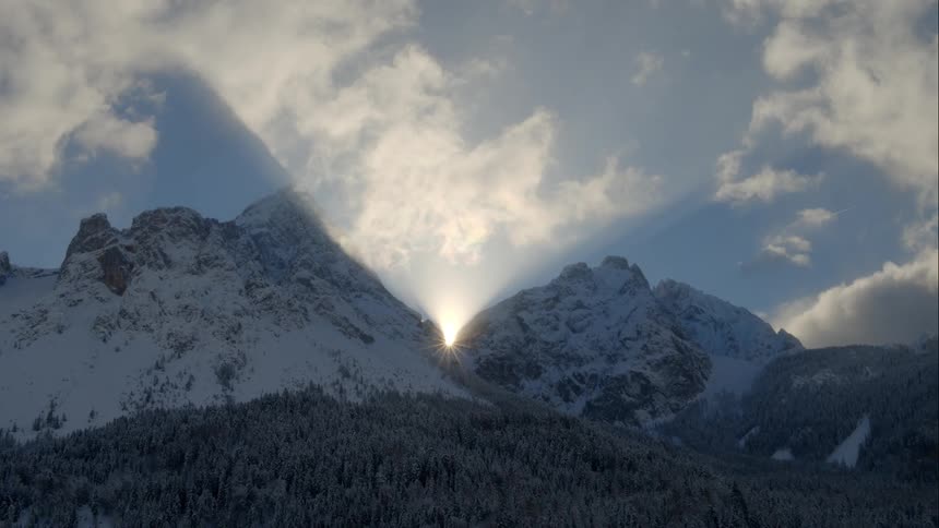 Snow capped mountain ranges at sunset