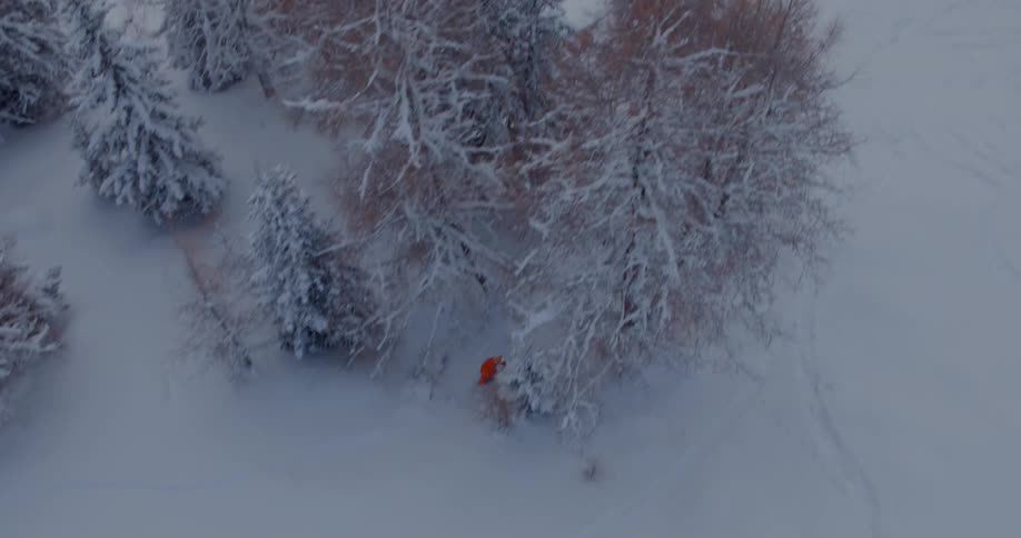 A man with red hoodie skiing