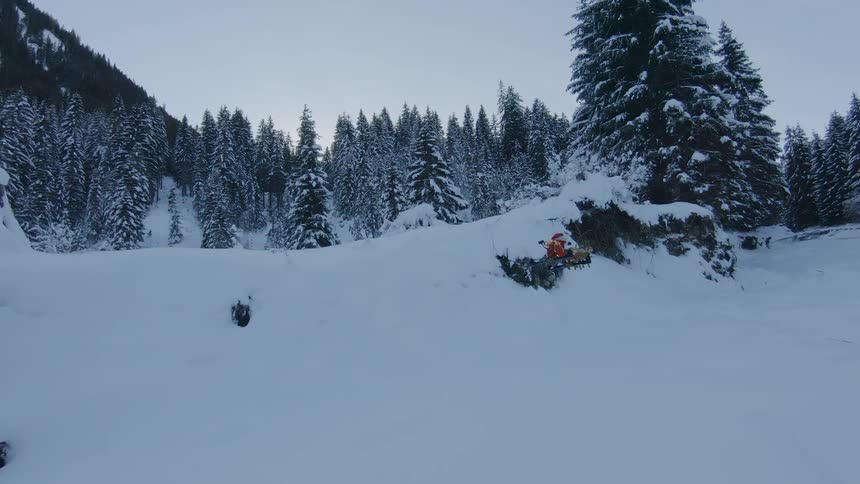 Drone flying in a snow covered forest