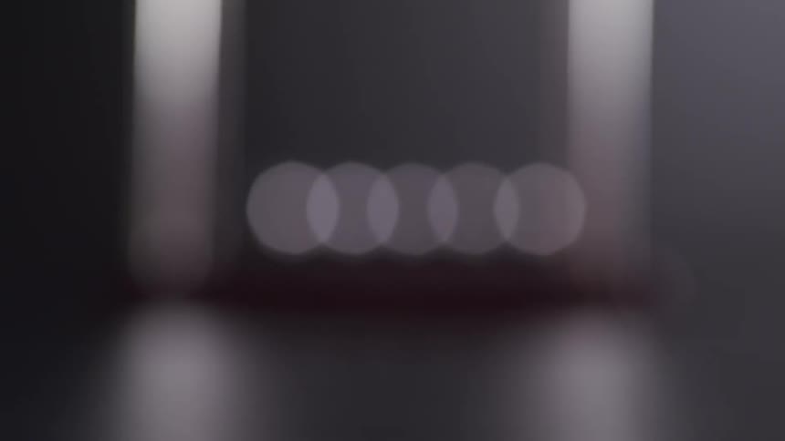 A silhouette of a pendulum moving