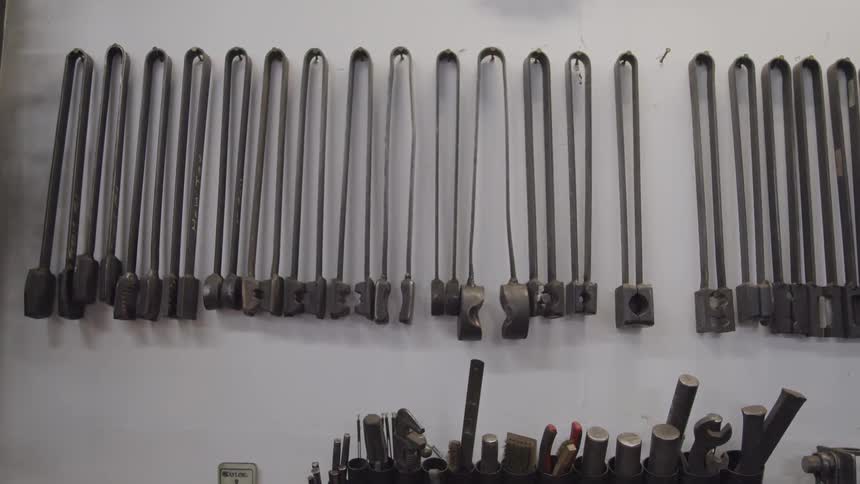 Tools hang on nails on the wall