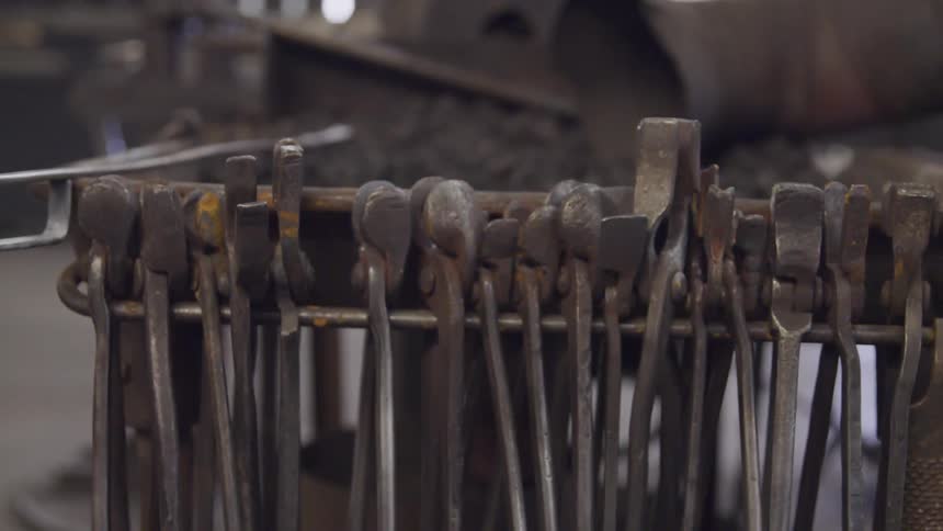 Classic blacksmiths tools on rack