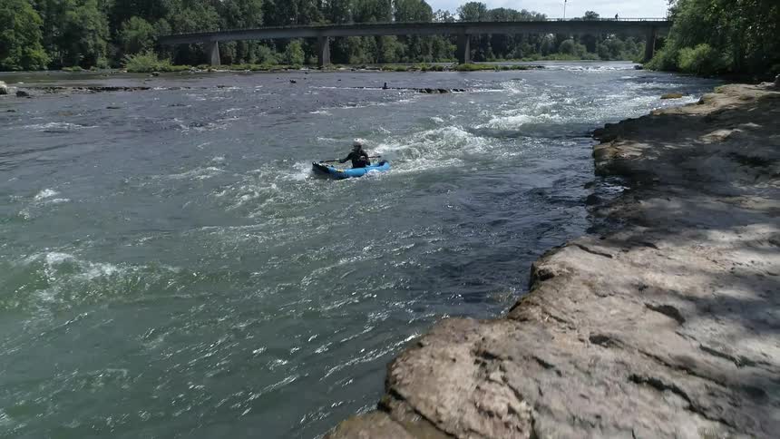 A man play canoe at the river