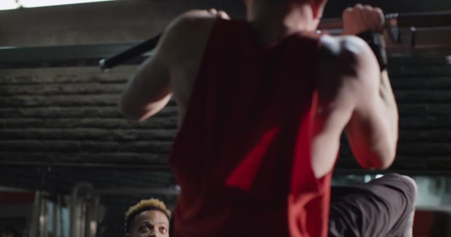 Men exercise in a gym