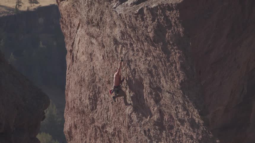 A man rock climbs