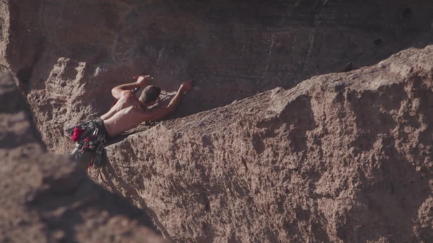 A man works on the rocks