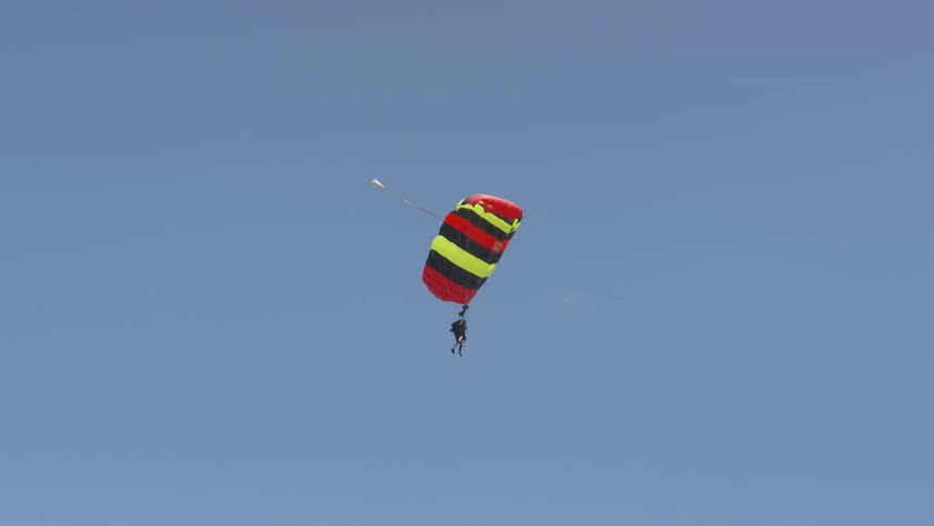 A man doing a parachute jump