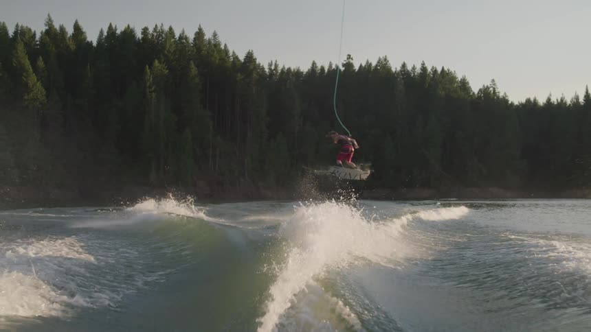 A man doing a parasailing at lake