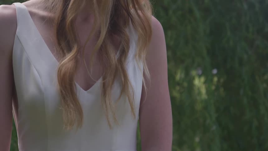 A woman is standing outside