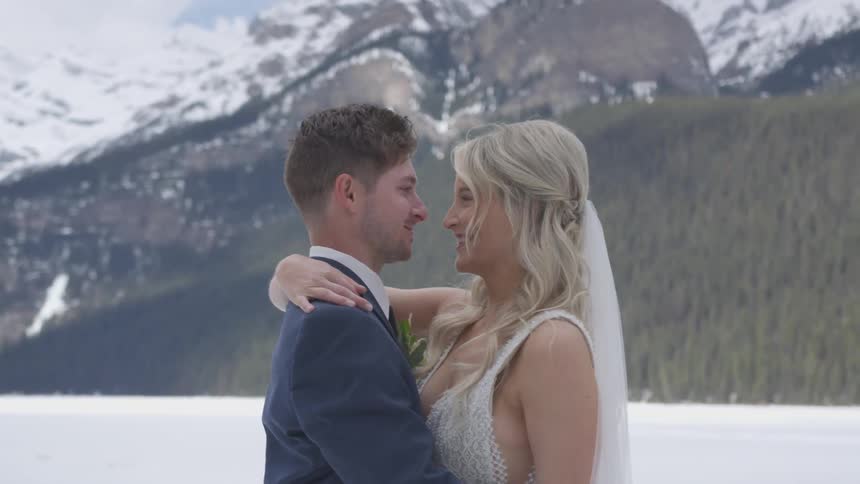 Man and woman embrace in a wedding outside