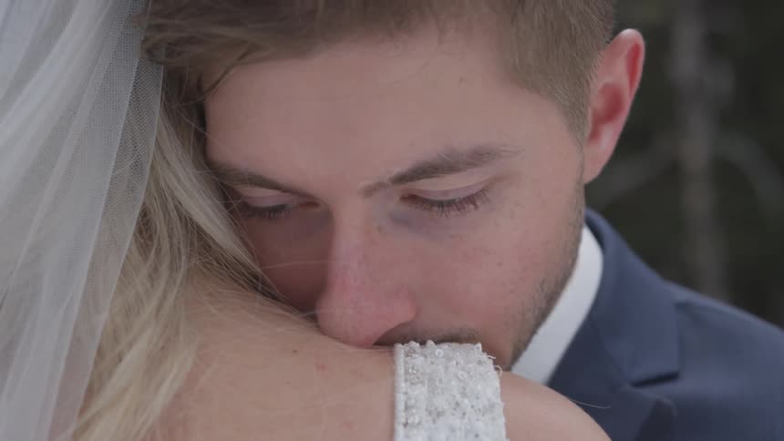 A man leaning on a womans shoulder