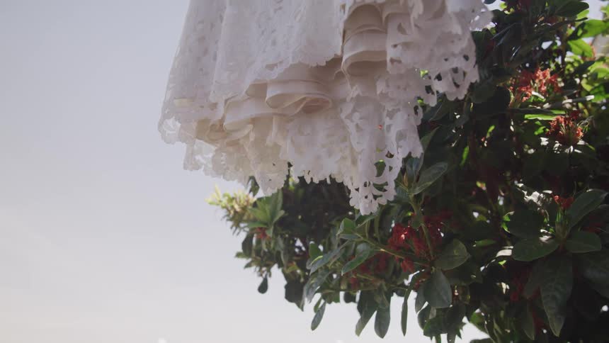 A white curtain blows by the wind