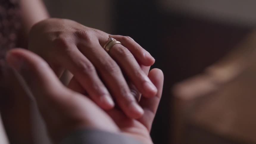 Couple holding hands
