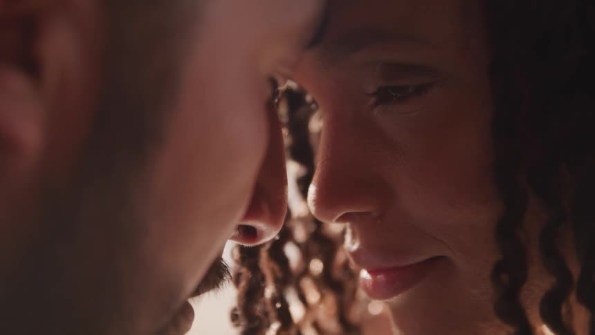 A couple touch their forehead