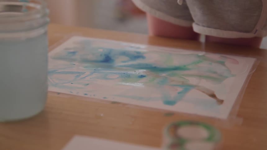 A painting taped to a table
