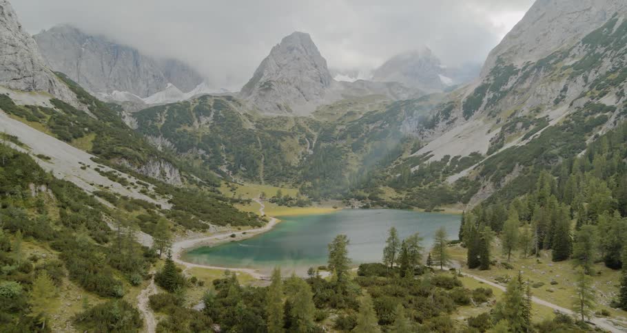 The small lake sits surrounded by mountains
