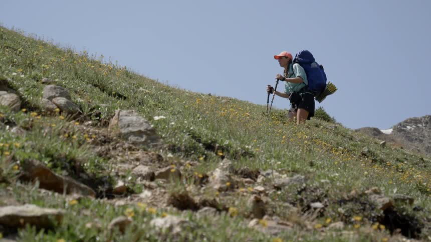 A woman hiking at the mountain
