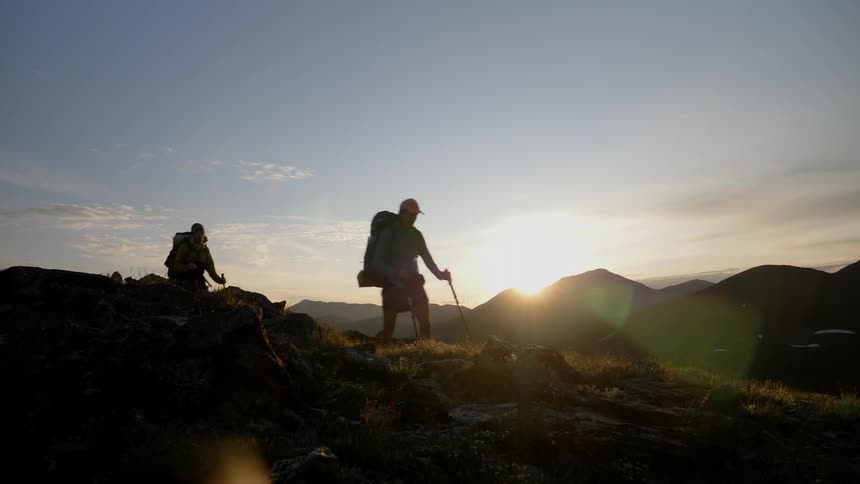 A man hiking at dawn