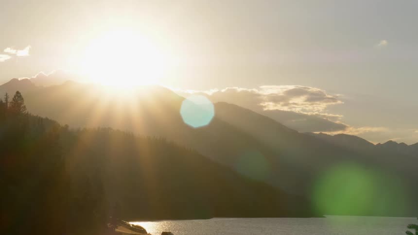 Sun goes down behind the mountains