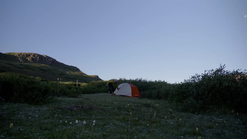 A man getting out from his camp