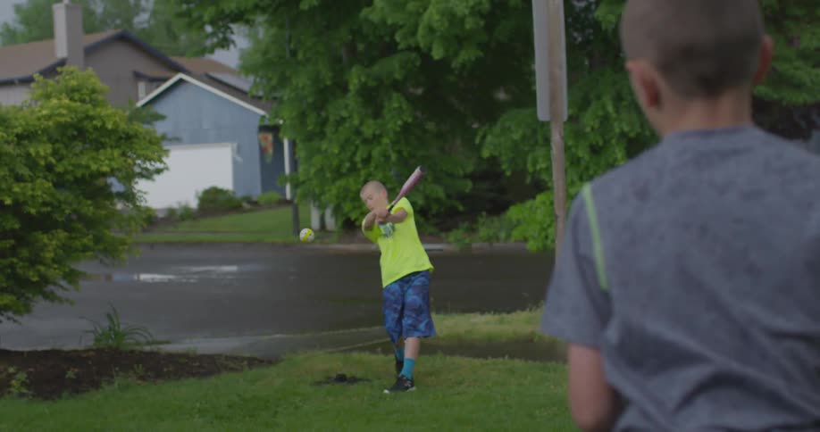 Kids playing baseball outside