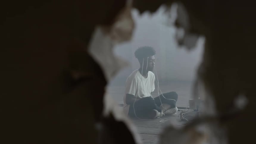 A black boy contemplating