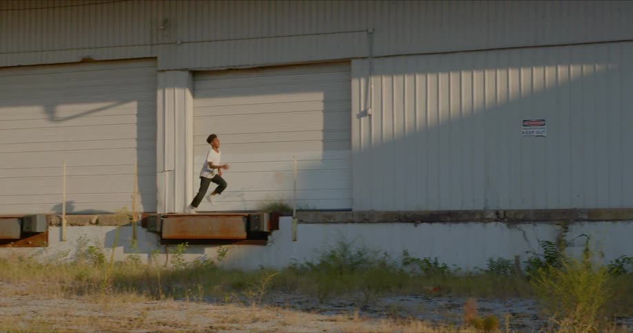 A boy running on the pathway