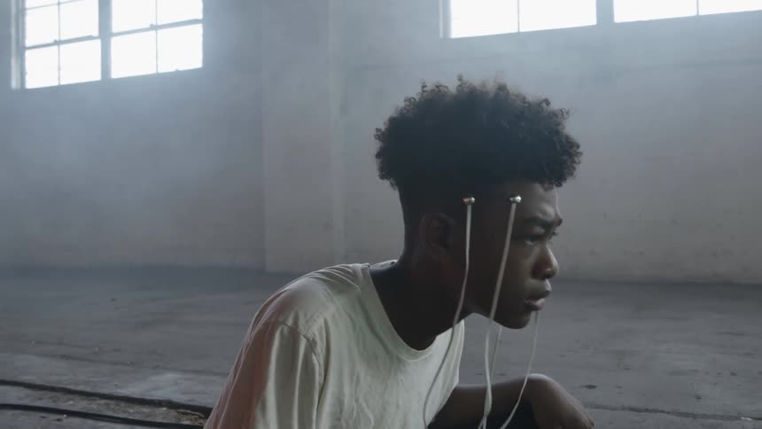 A black boy with cable device in his head