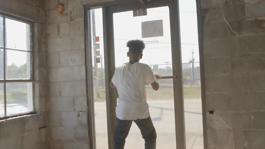 Black boy runs in the construction