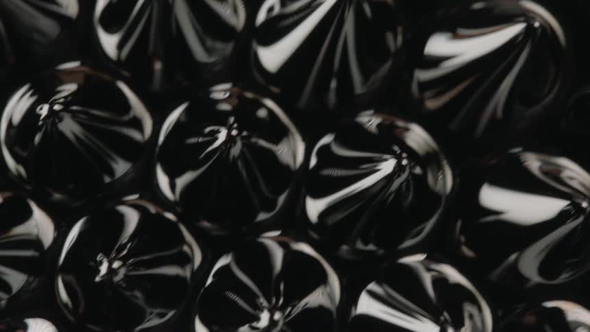 Magnetic fluid moves past in a group of drops each with their own little peak