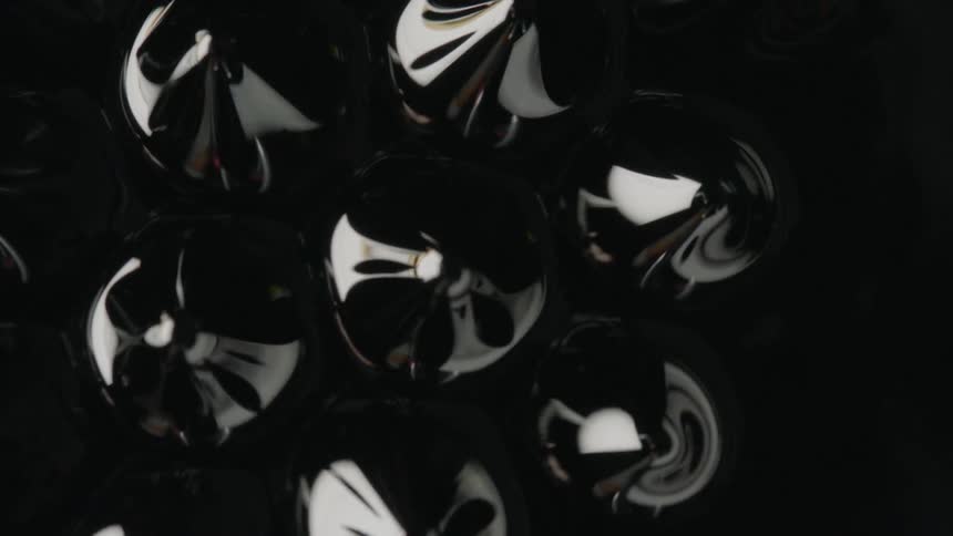 A thick black liquid raising from a puddle